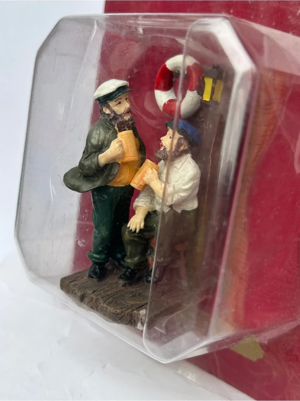 Christmas village chatting sailors